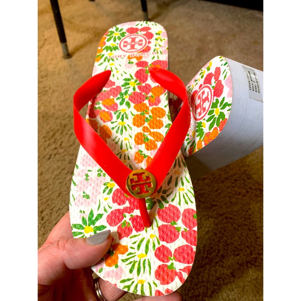 New never worn - Tory Burch flip flops. Floral pattern size 7 small wedge
